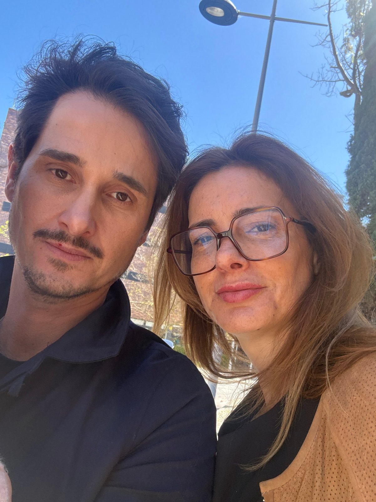 Couple takes selfies on sunny day in Lisbon