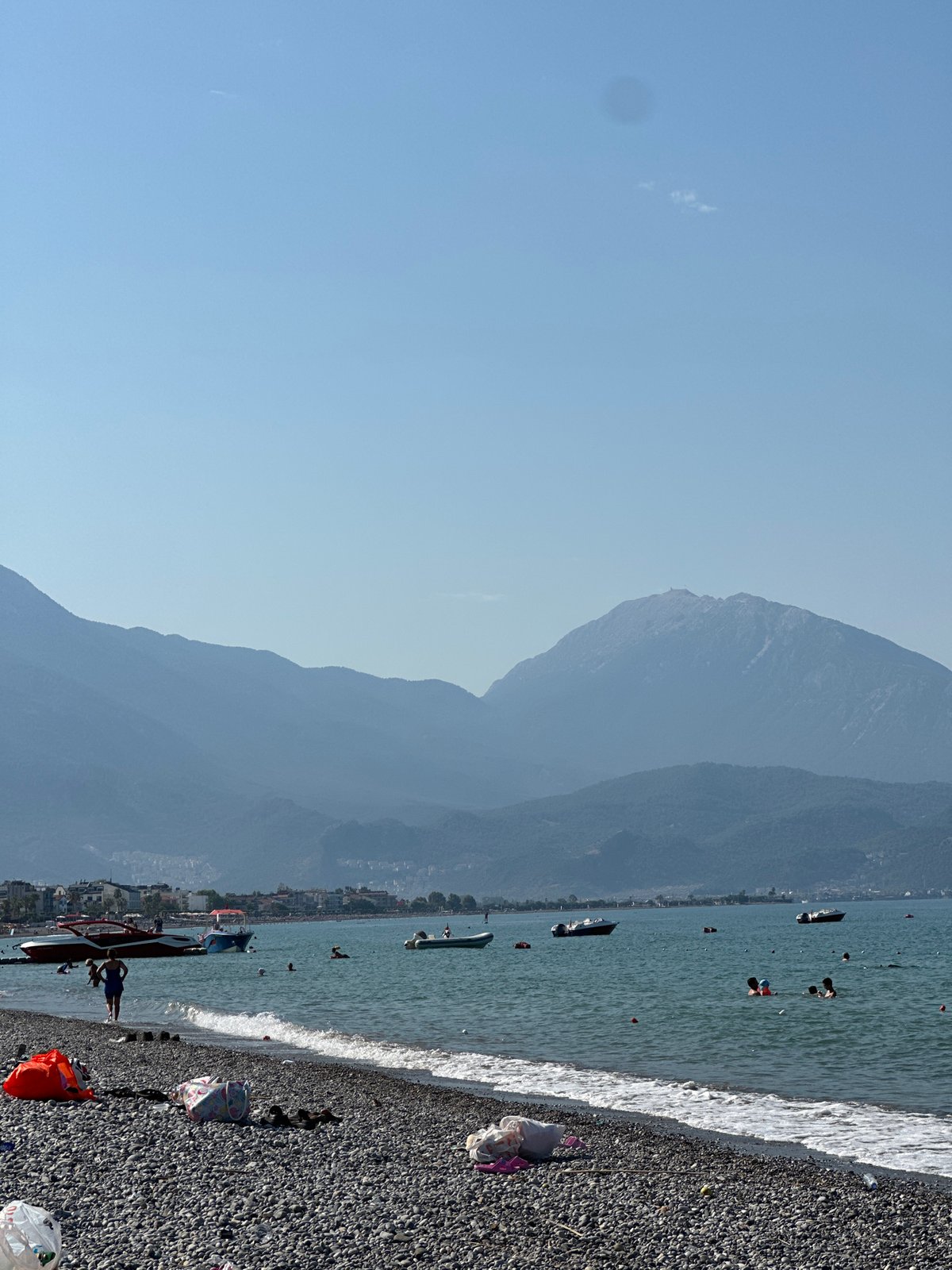 A relaxed morning swim session on a Fethiye pebble beach.