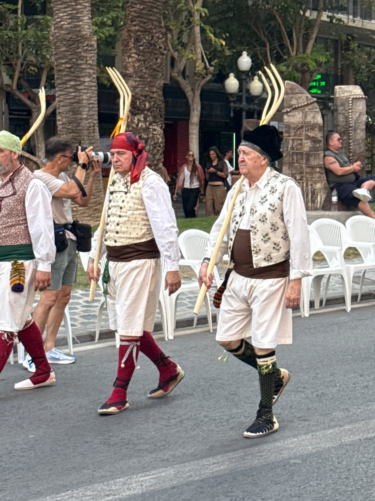 Traditional Spanish parade with Valencian costumes and marching bands