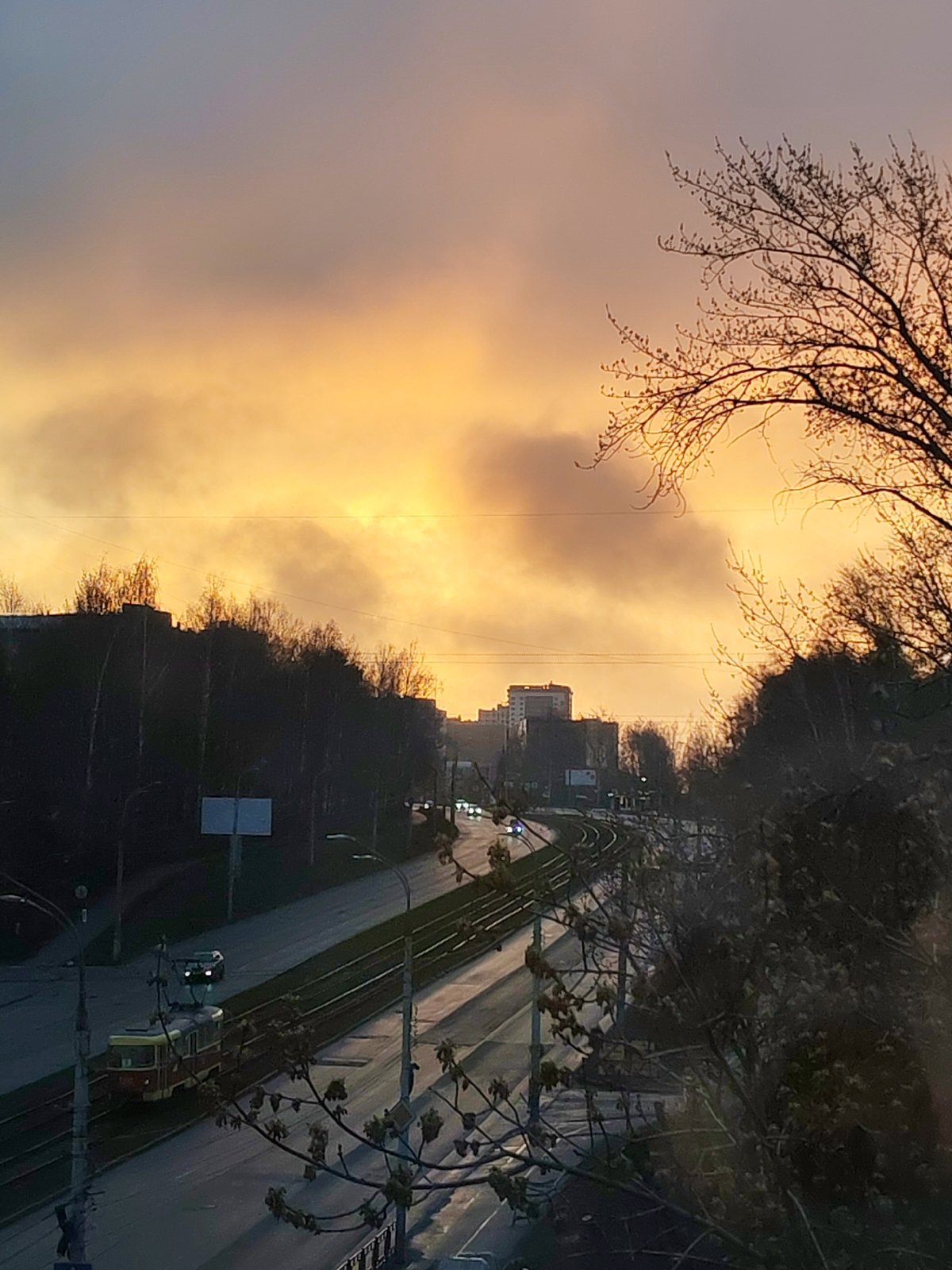 Dramatic sunrise/sunset illuminates Izhevsk streets and tram lines