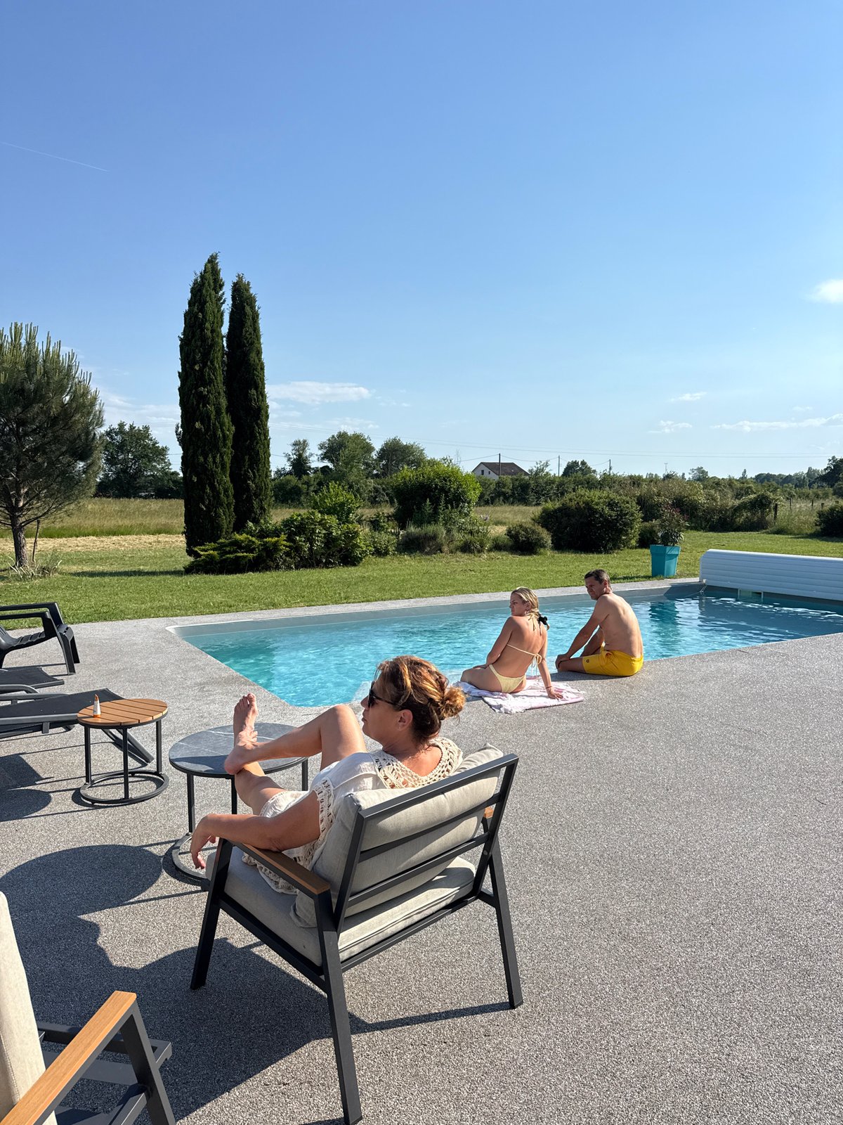 Couple enjoys sunny afternoon at Veauchette swimming pool