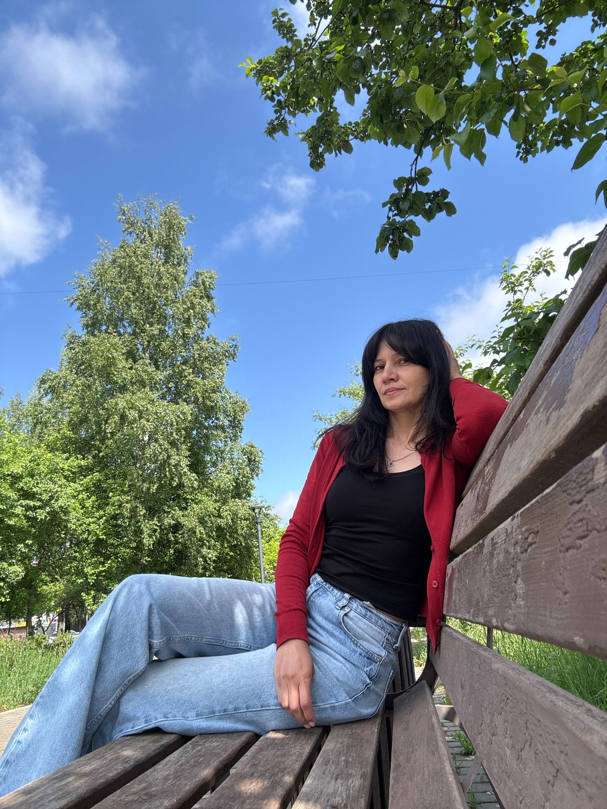 Woman enjoys sunny morning photo session in Chaikovsky park