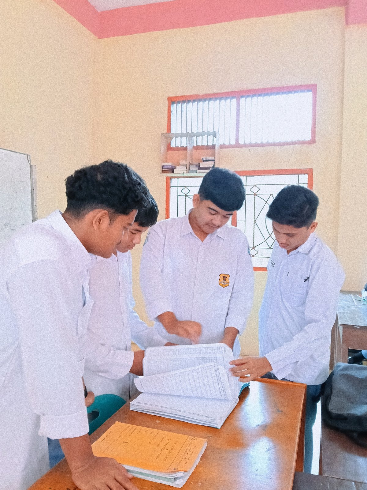 Students and residents go about daily routines in Lhokseumawe