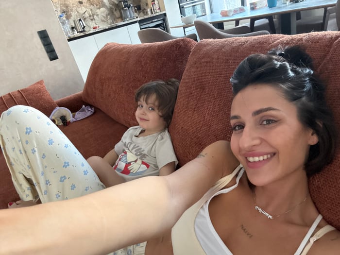 Morning routine captured: woman, child together in Khimki home