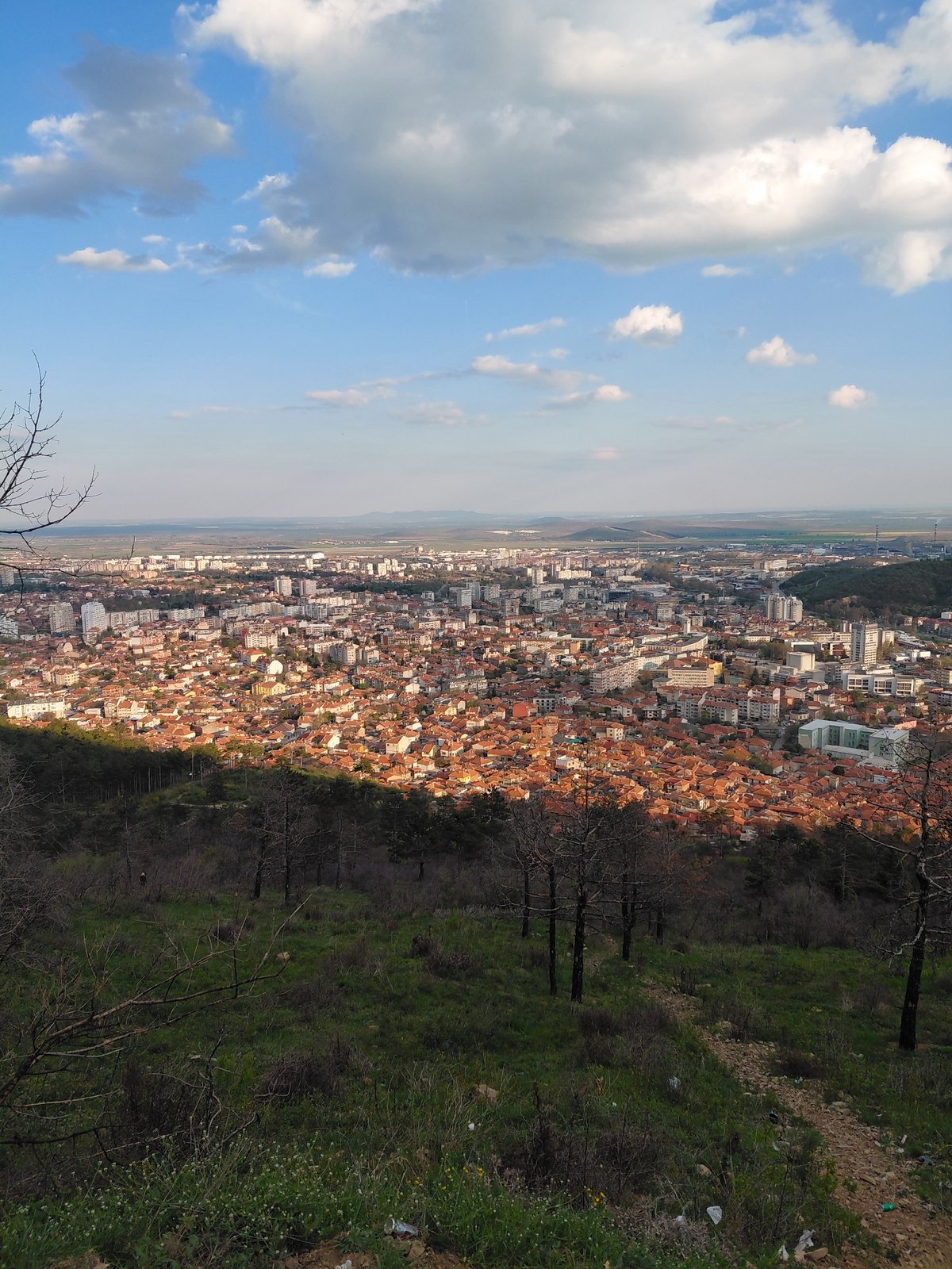 Aerial view captures Sliven, Bulgaria cityscape under cloudy skies