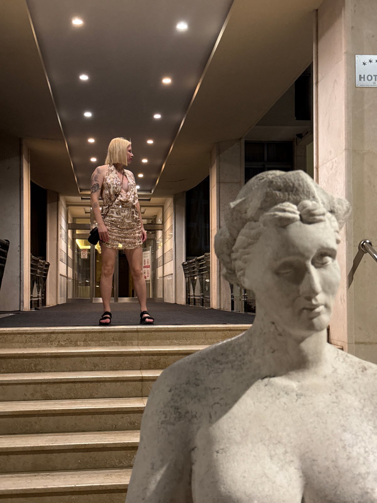 Woman in sequined dress spotted at Montenegro hotel entrance