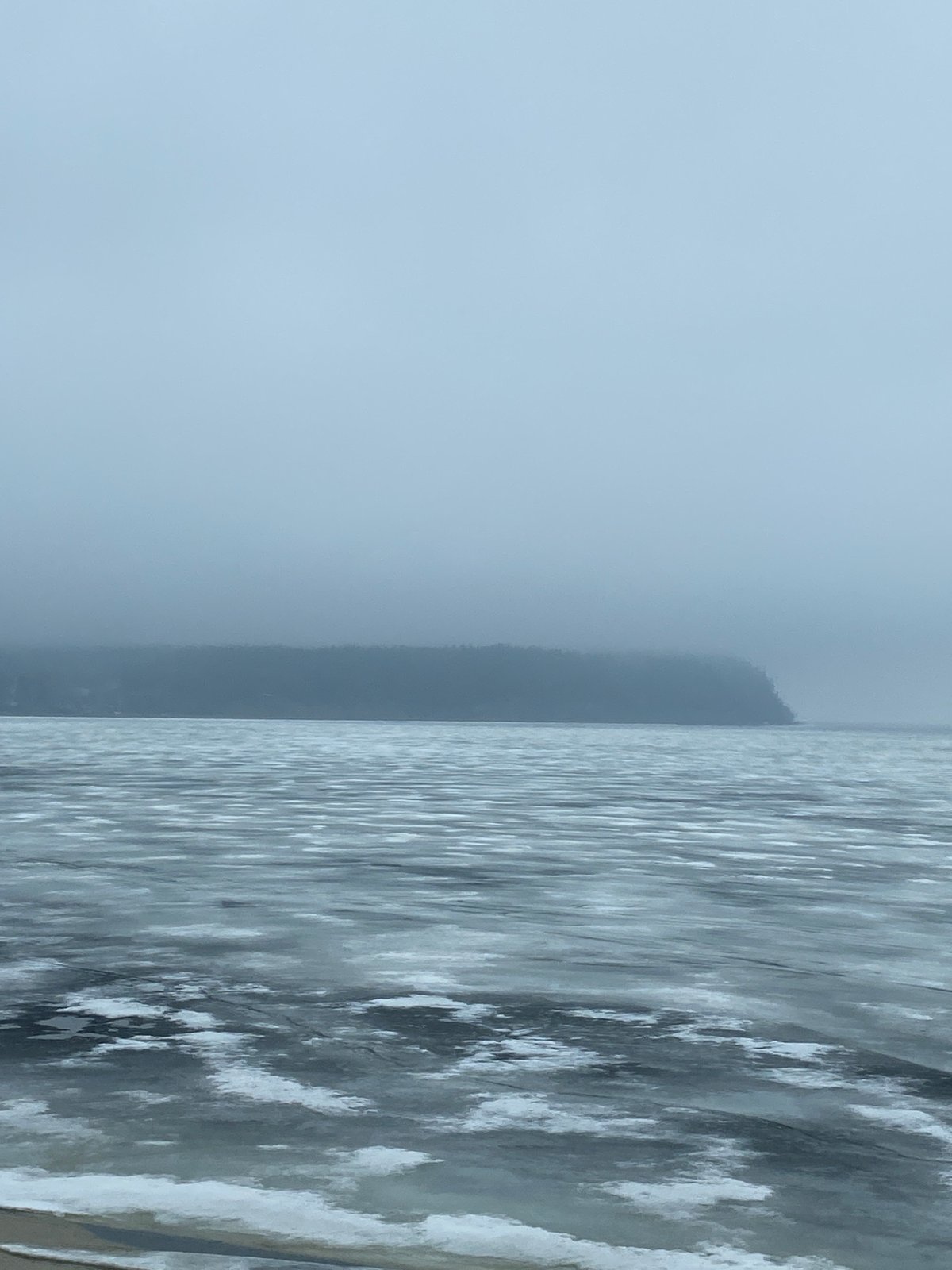 Spring ice patterns observed on water body in Chaikovsky