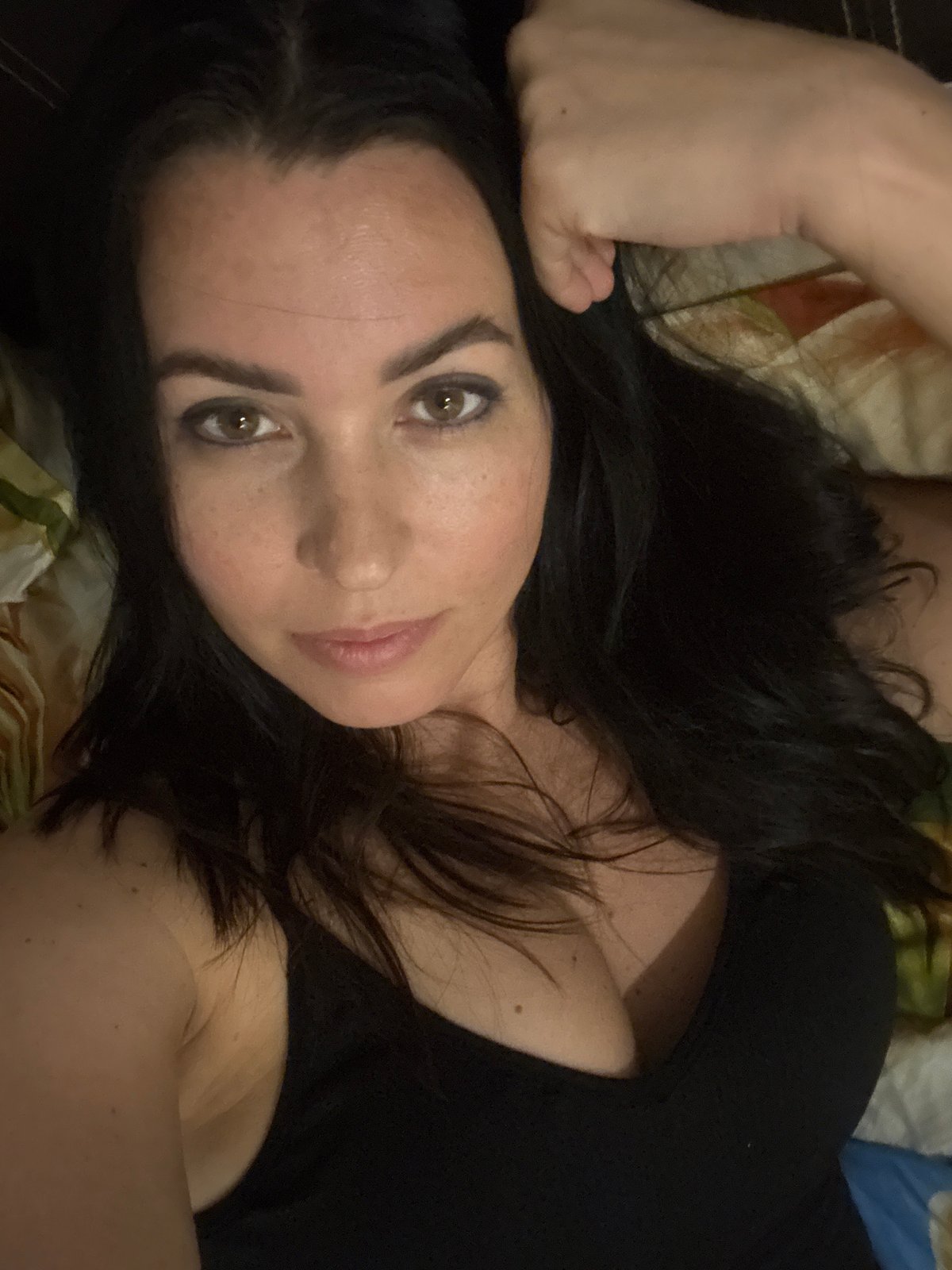 Woman photographed in bedroom setting in Pattaya, Thailand