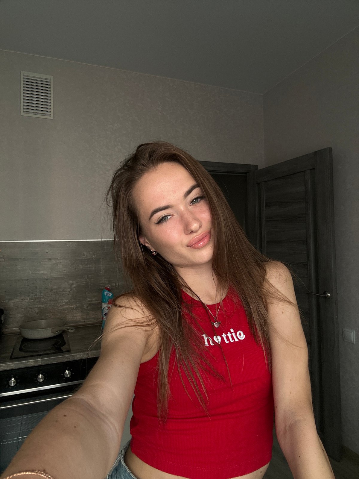 Kitchen selfie session with multiple poses and expressions