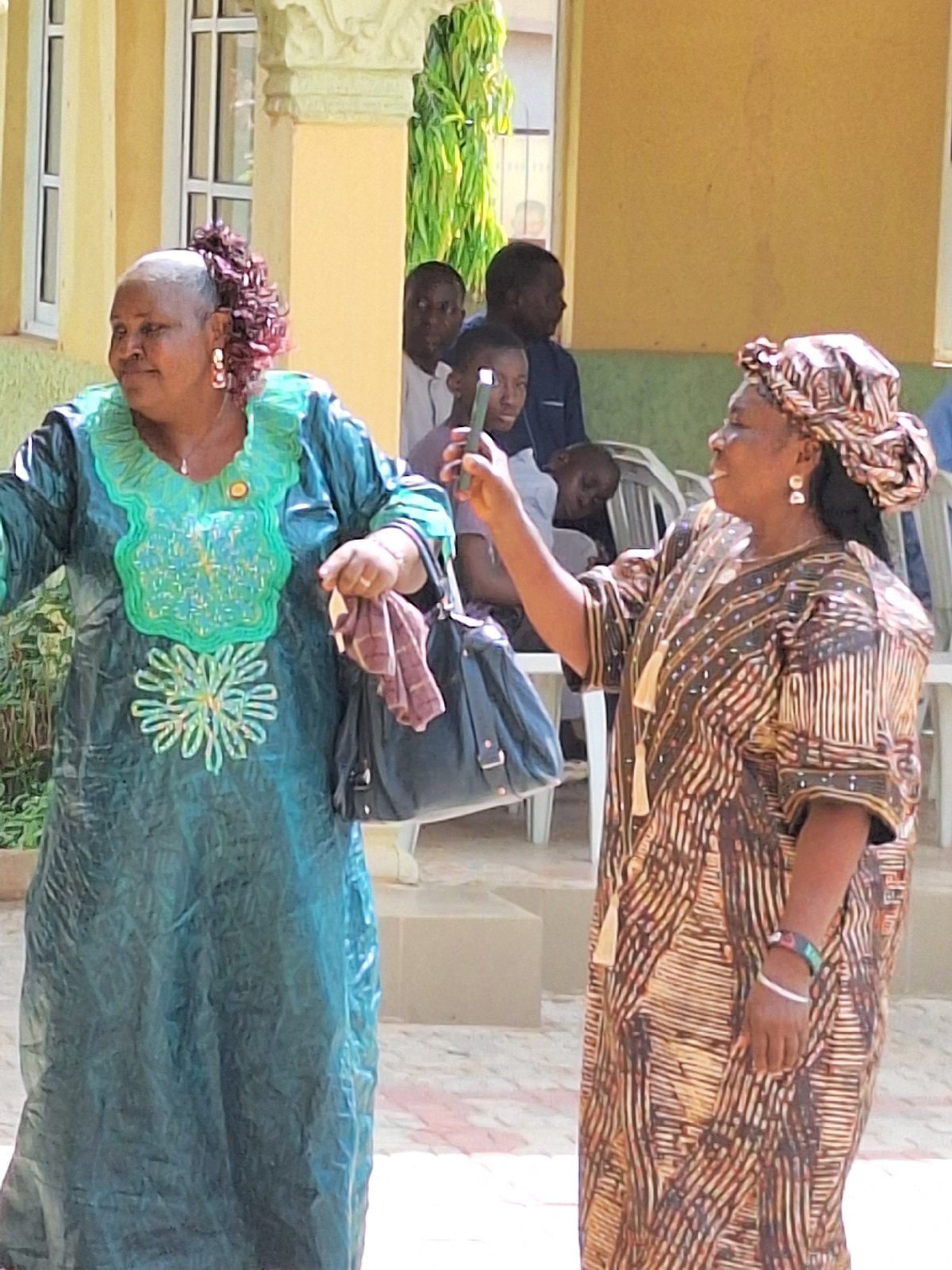 Community gathering with traditional dress and dancing in Rido, Nigeria