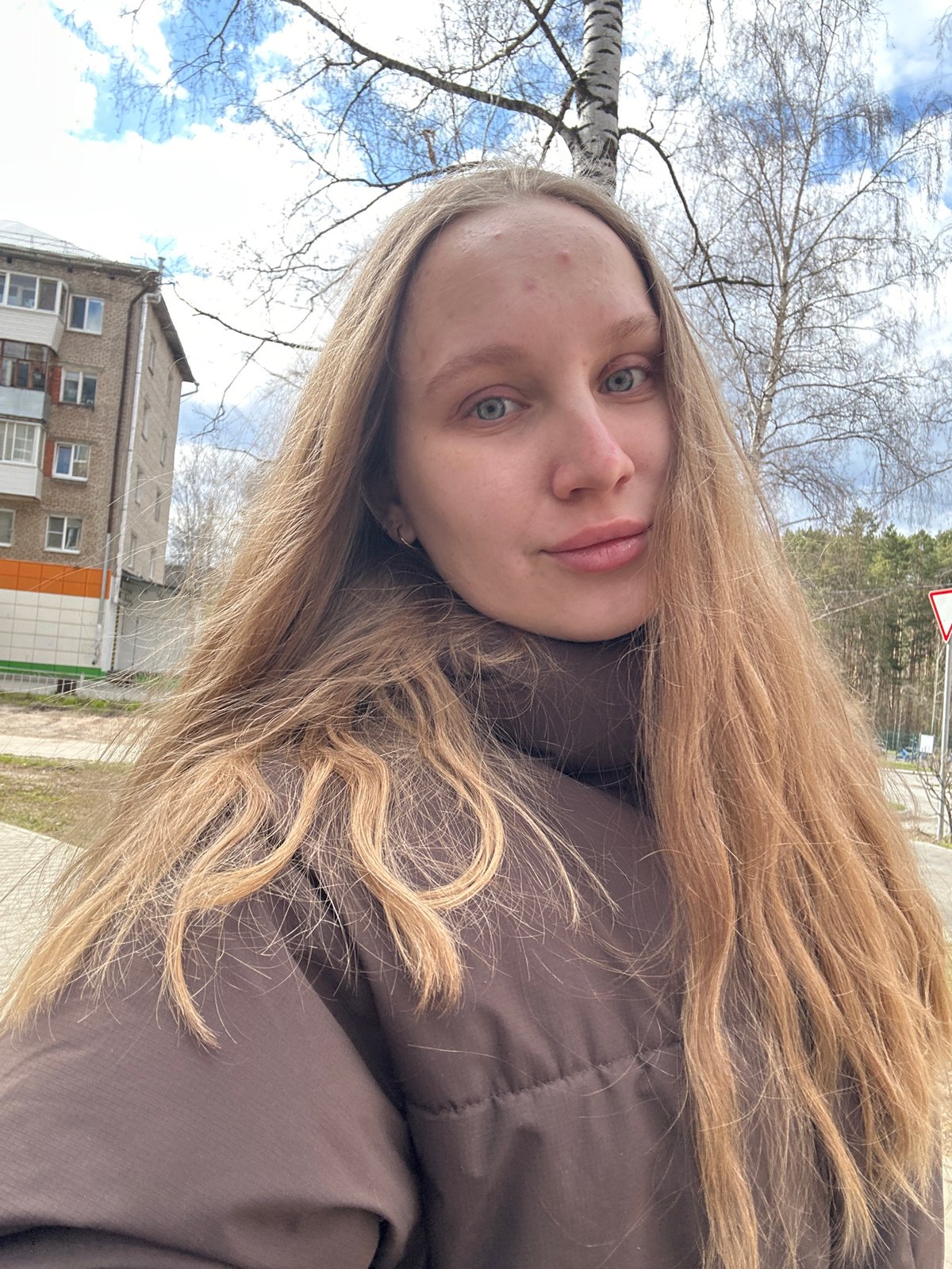 Woman photographed, flowers on steering wheel in Chaikovsky