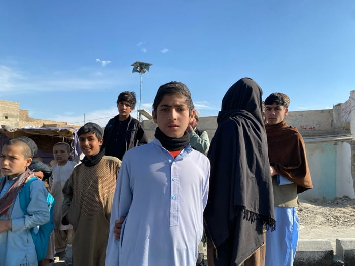 Afghan village witnesses road paving project with heavy machinery