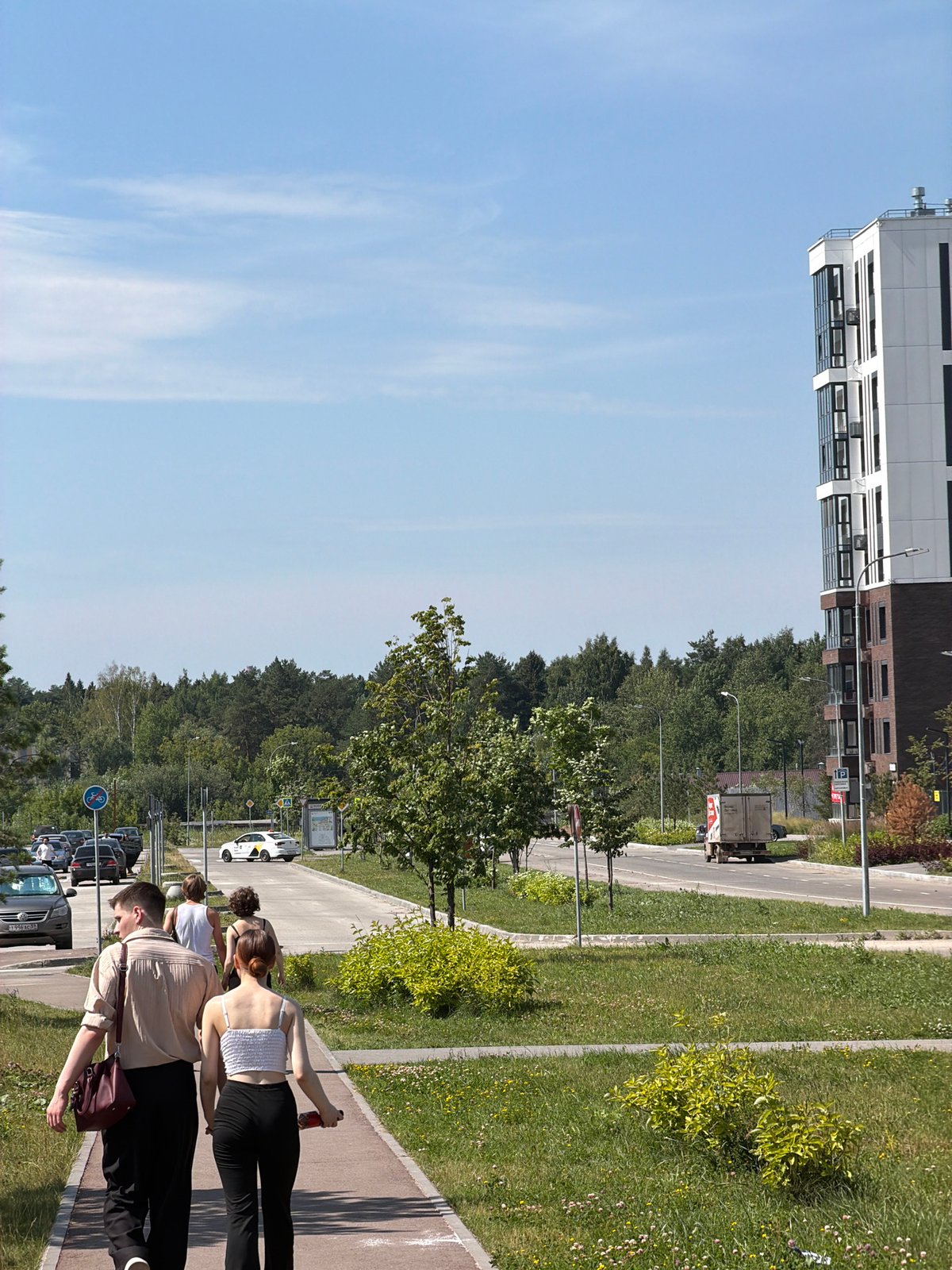Summer stroll near a Perm commercial district with inflatable fairground