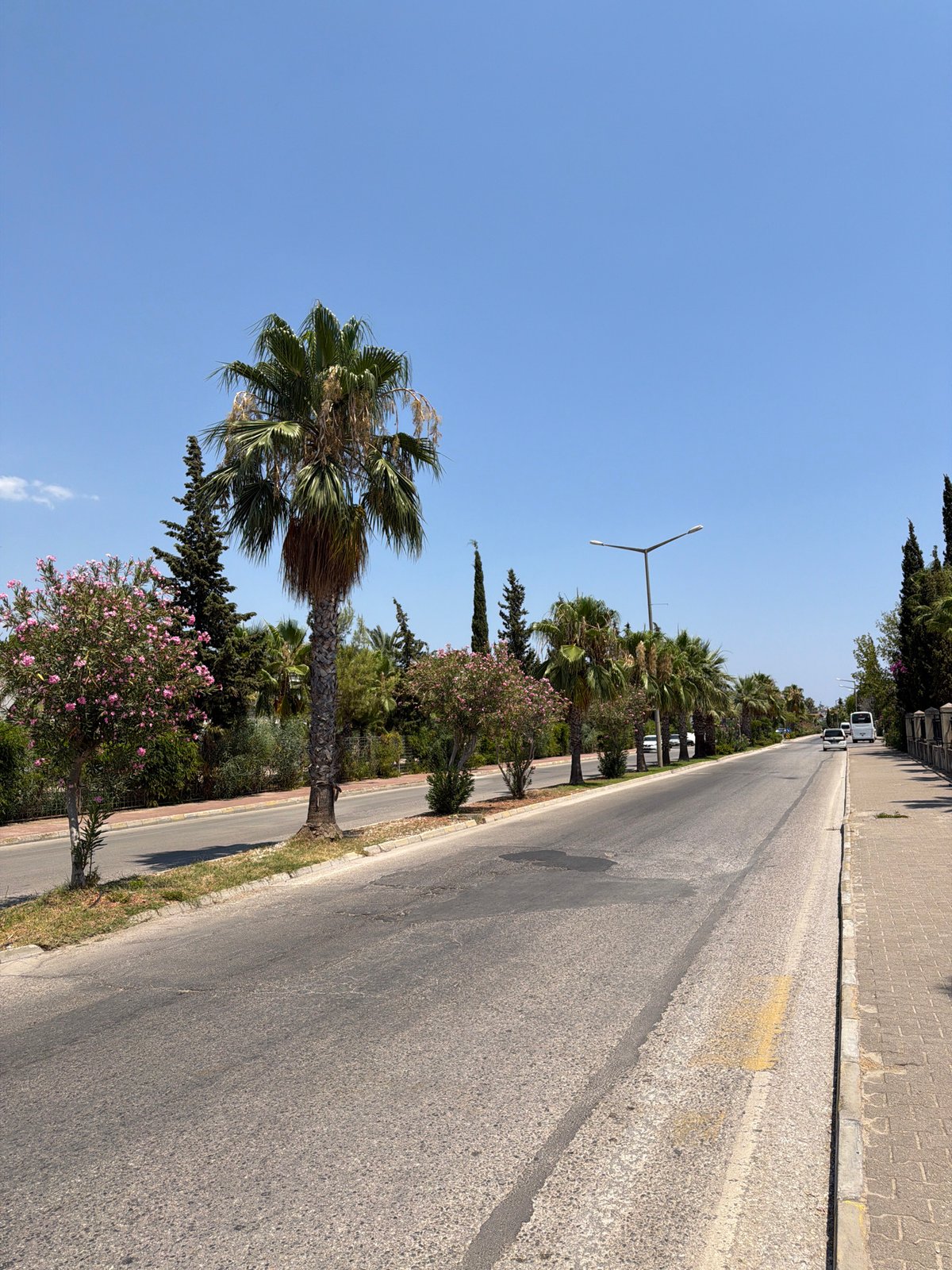 Bus ride through Kemer's sunny streets, July morning