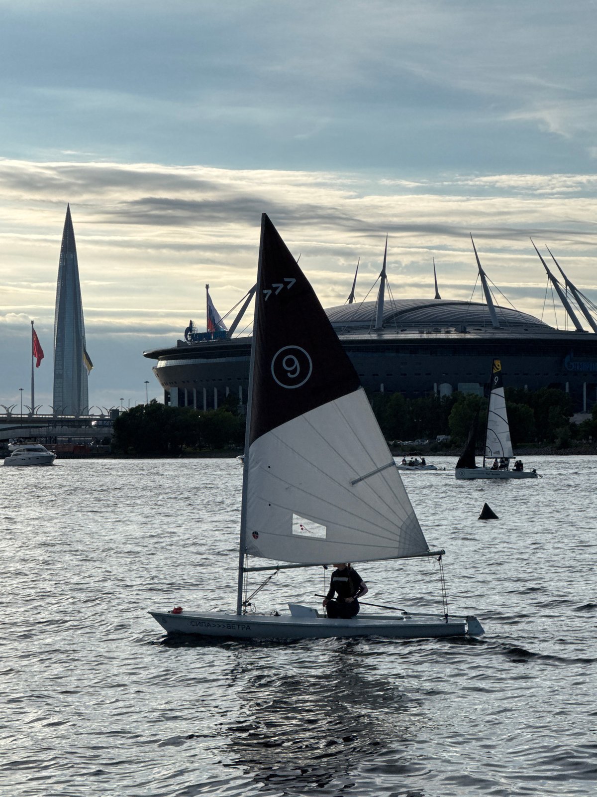 Regatta on the Neva with the WHSD bridge at sunset