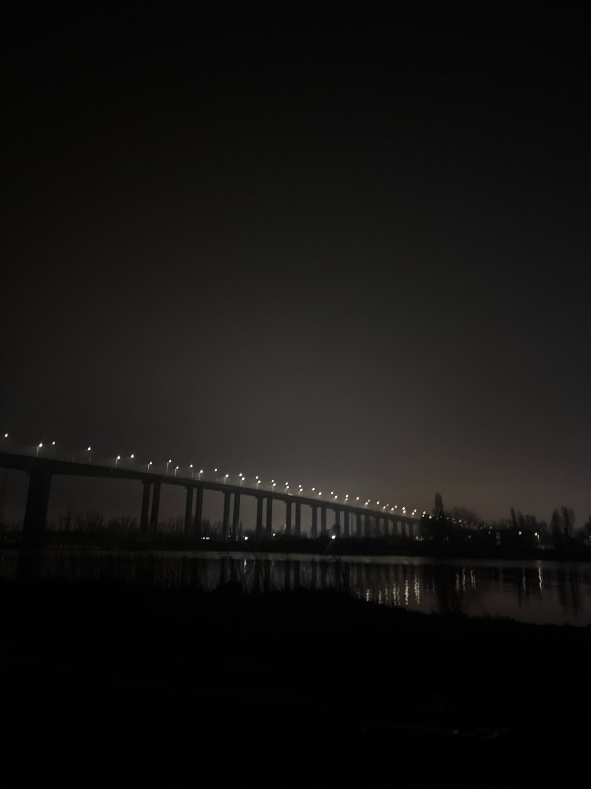 Foggy night scenes captured around illuminated Varna bridge