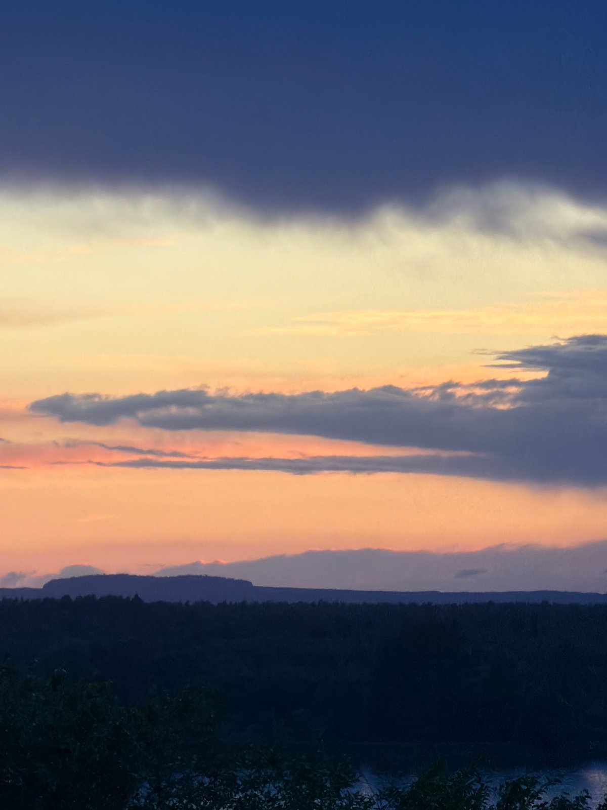 Dramatic sunset captured over Chaikovsky waterway amid striking weather