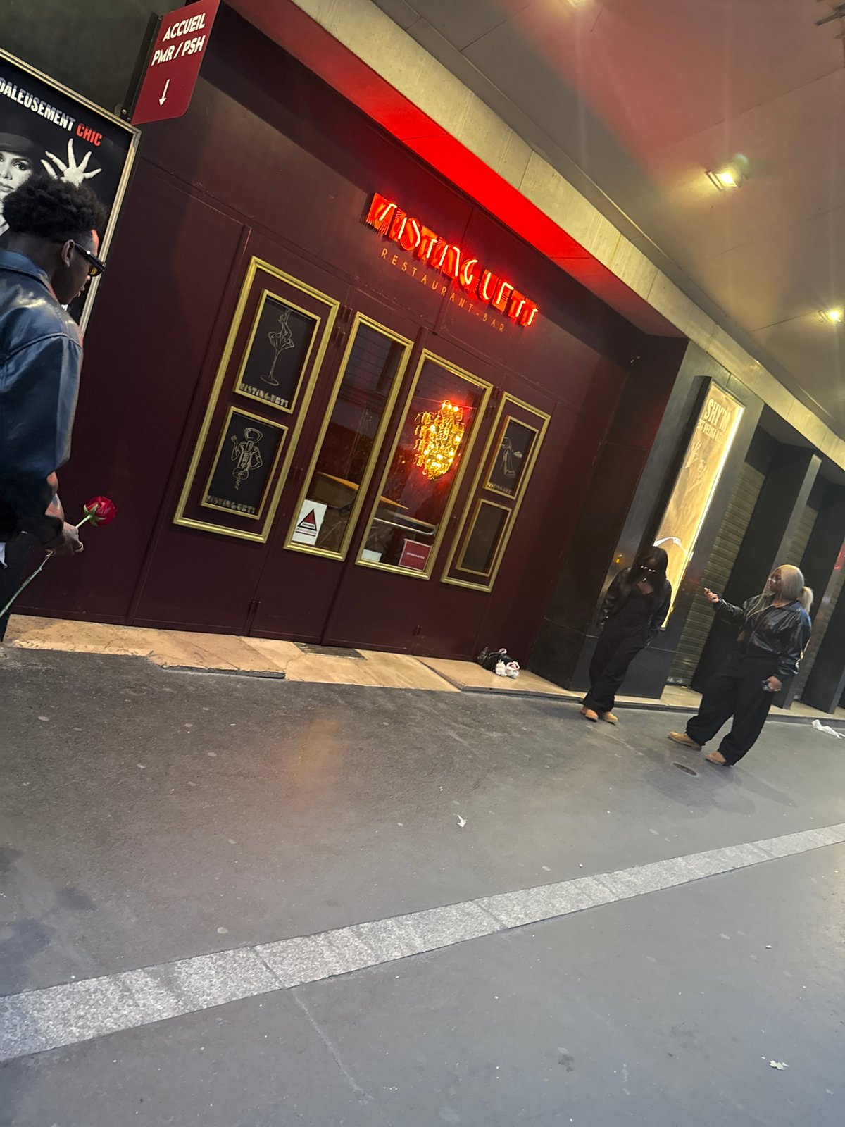 Evening activity documented near Paris restaurant during dusk hours