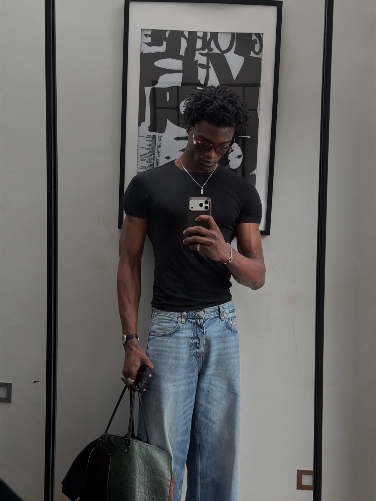 Man takes mirror selfie in London indoor location