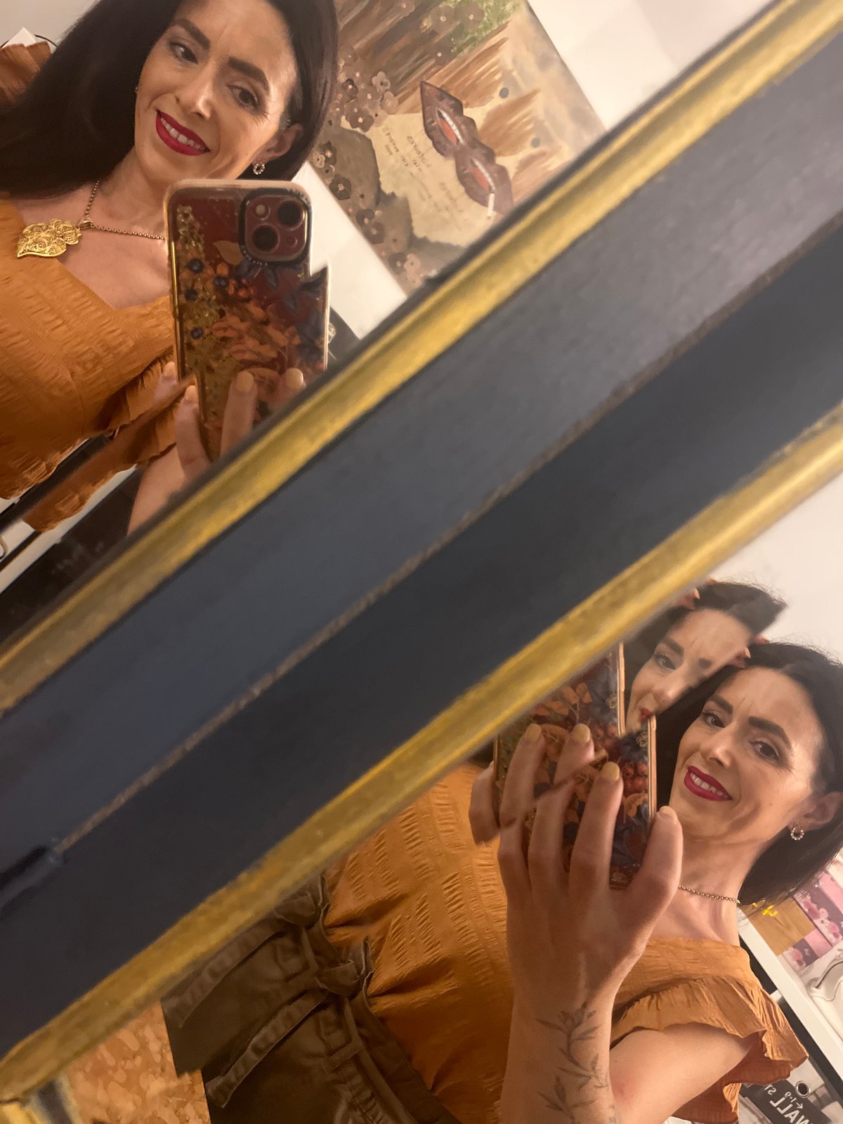 Woman takes mirror selfie in decorated interior, Konz Germany
