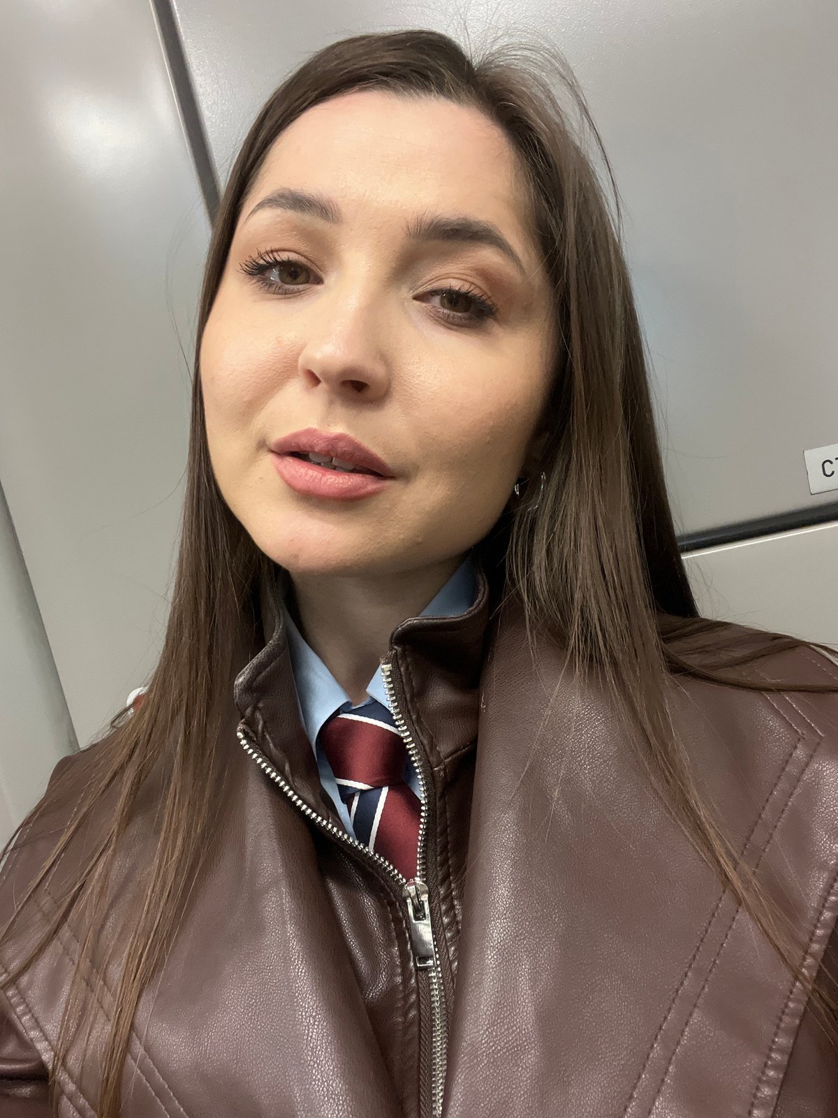 Woman in brown leather jacket photographed in Moscow