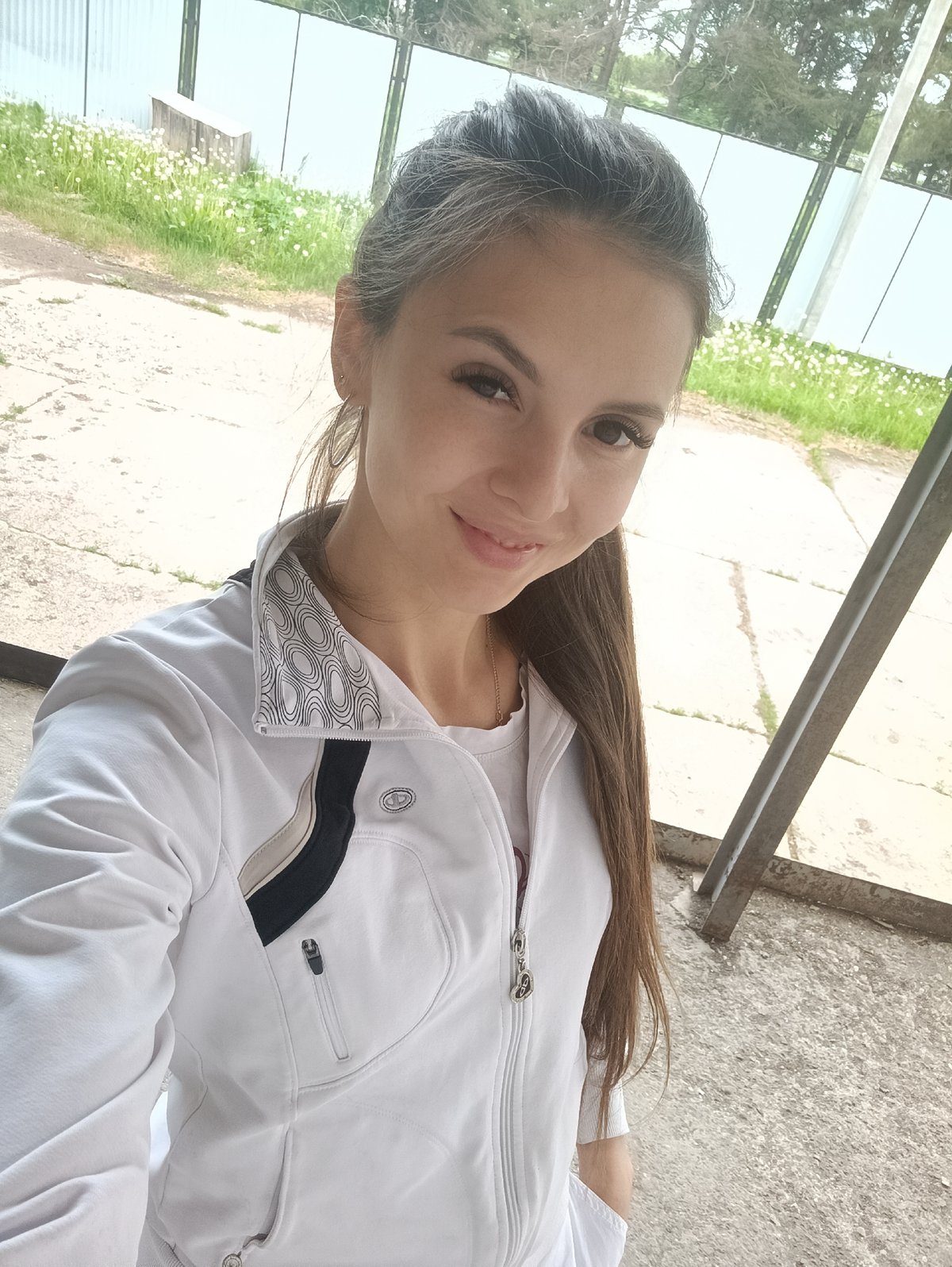 Woman photographed in outdoor selfie and indoor chair poses