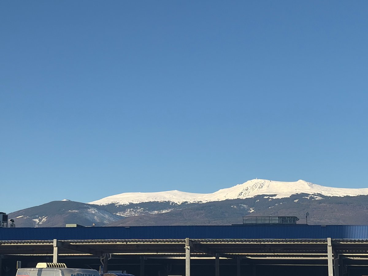 Snow-covered Vitosha Mountain visible from Sofia urban location