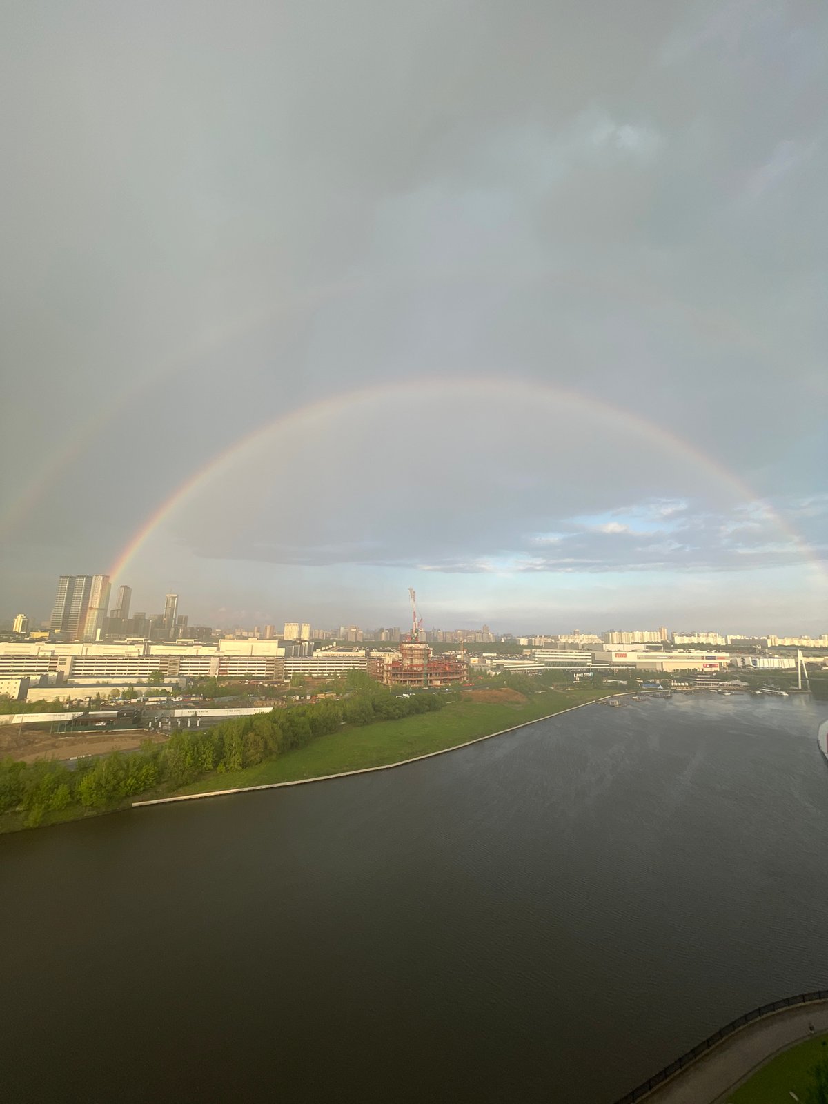 Double rainbow appears over Khimki, Russia cityscape