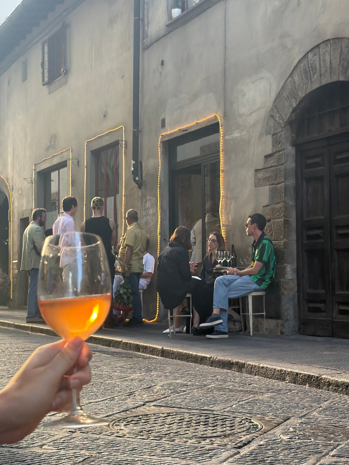 Evening aperitivo vibes outside a Florence stone building
