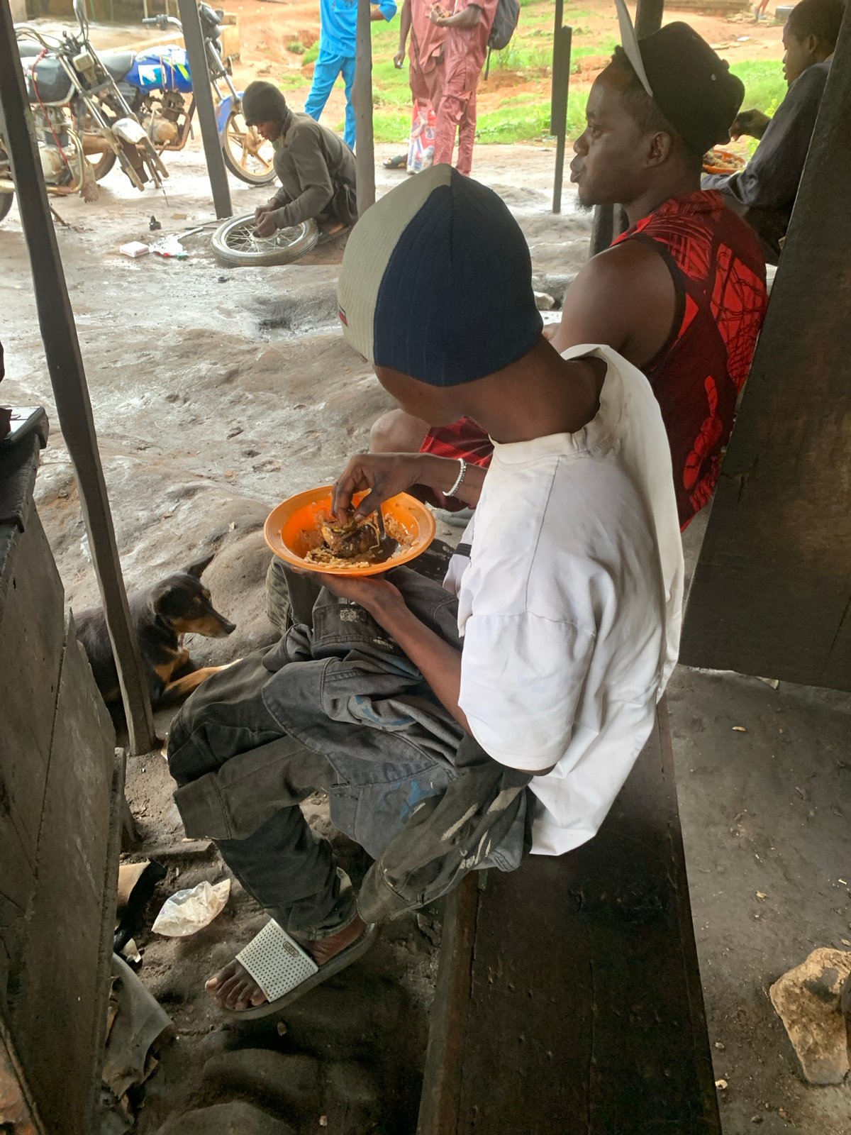Everyday street life along a rainy Shagamu roadside