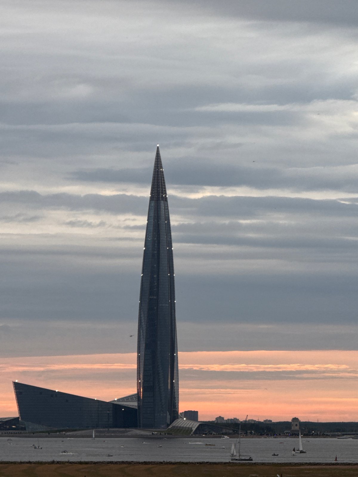 Lakhta Center towers over Saint Petersburg's cloudy summer waterfront