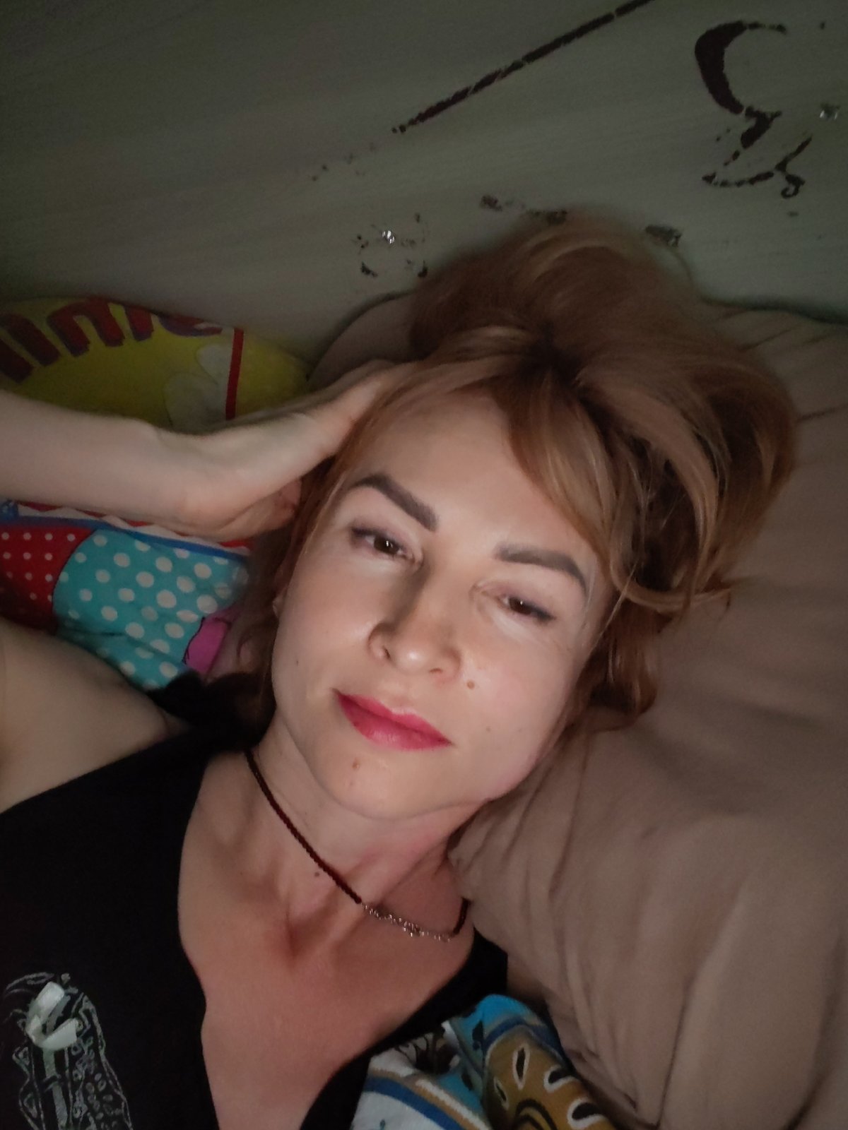 Woman resting on bed observed in Chaikovsky, Russia