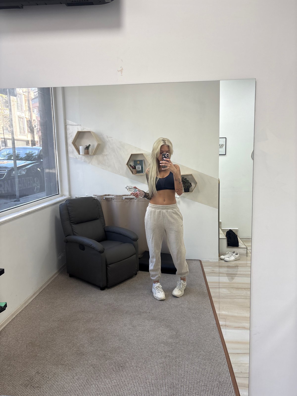 Woman takes mirror selfie in athletic wear in Plovdiv
