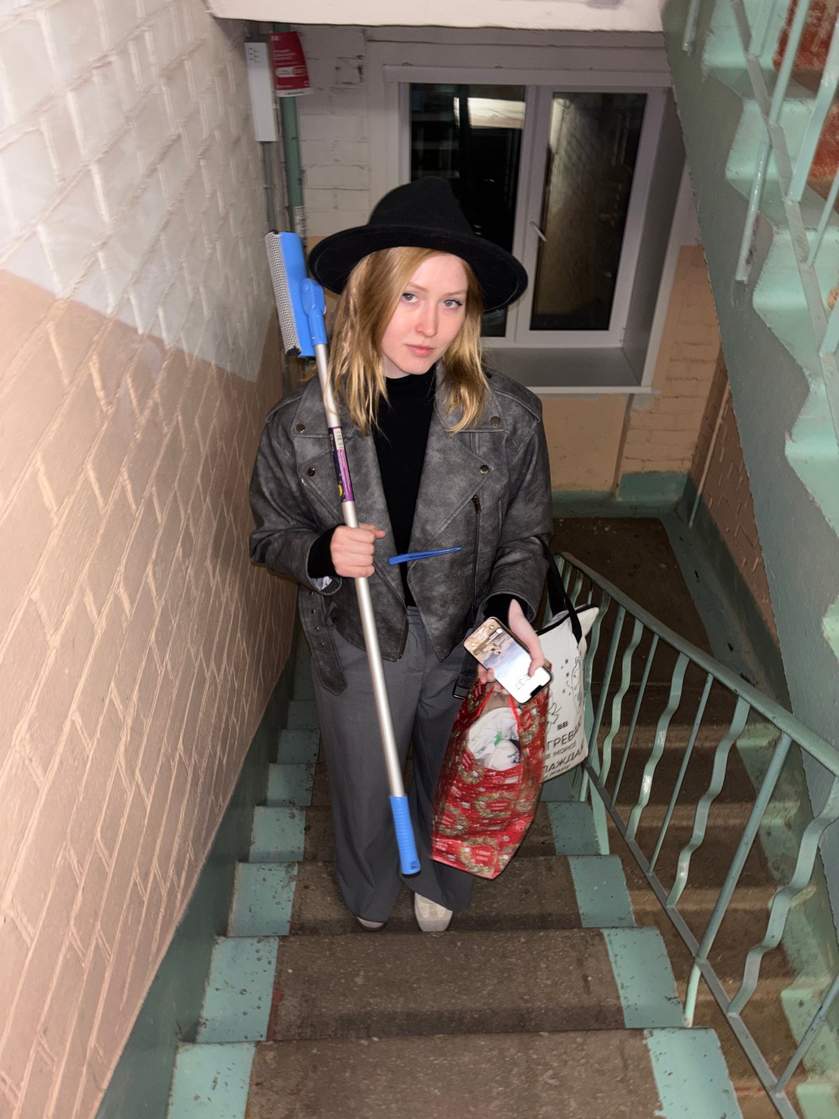 Young person photographed on indoor staircase in Perm building