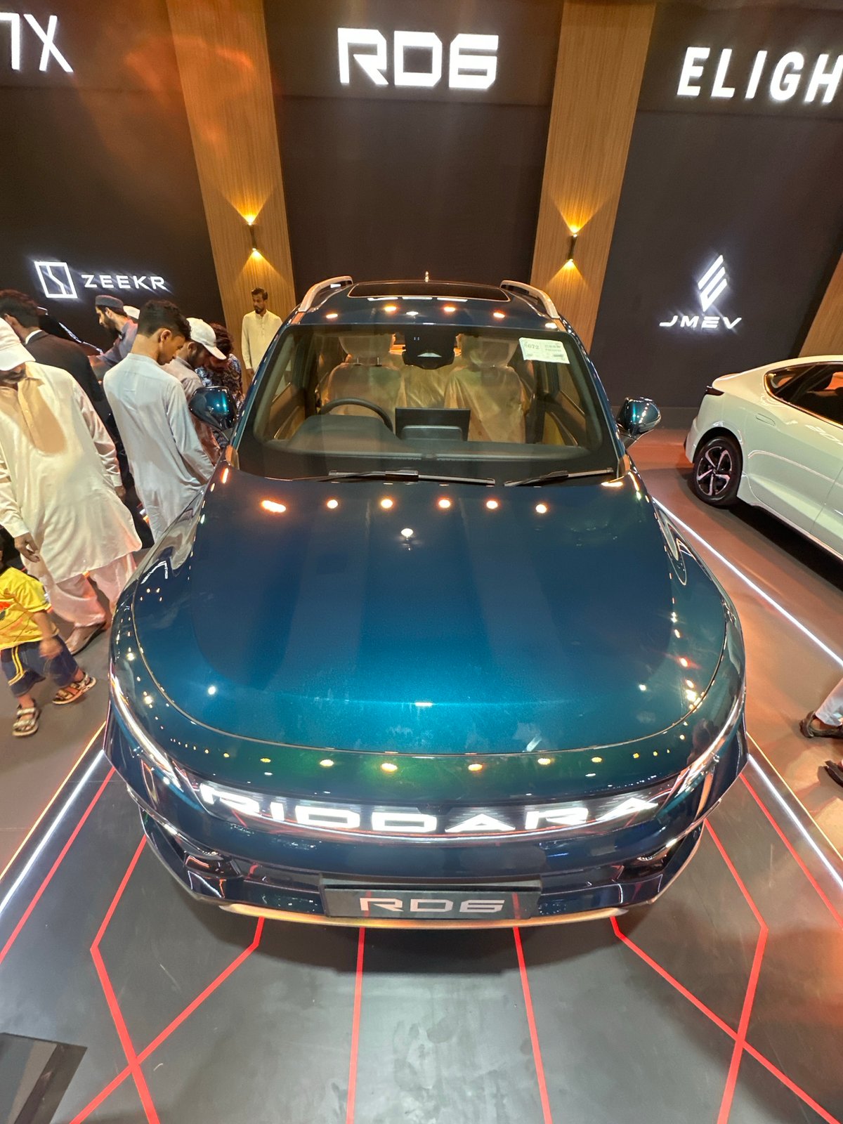 Electric and concept cars on display at an indoor auto exhibition