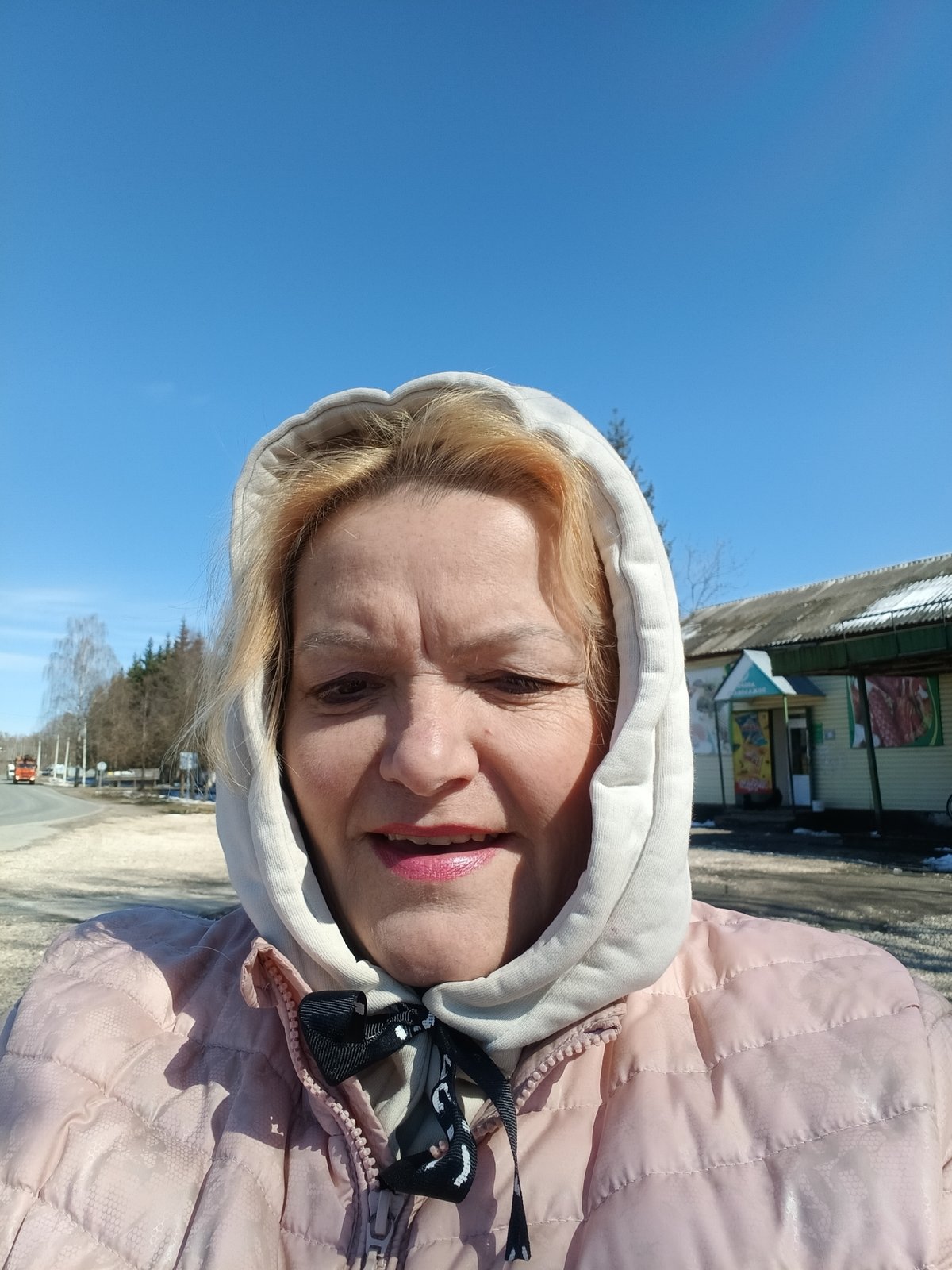 Woman and dogs spotted in spring park scene in Красный Маяк