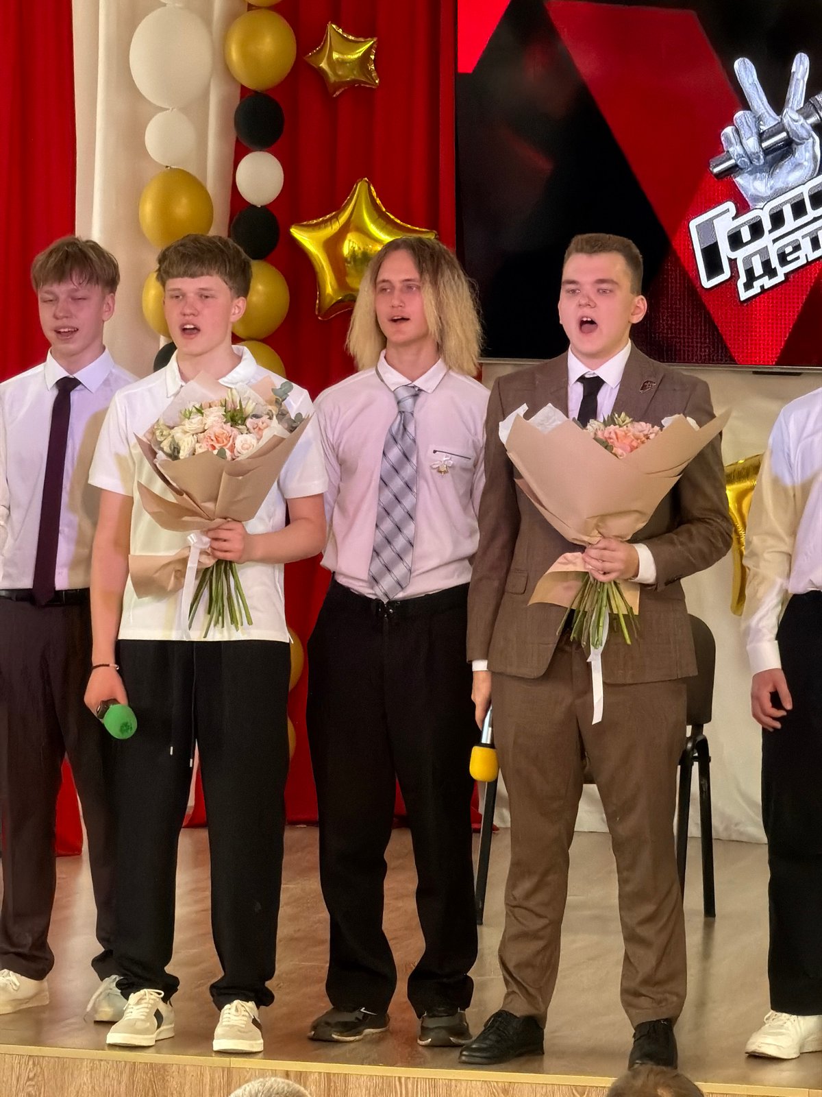 Four men pose at ceremonial event in Izhevsk