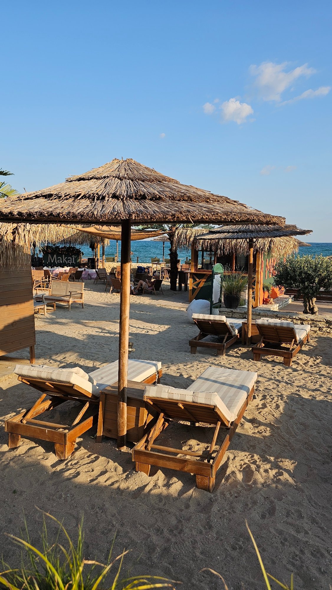 Balchik seafront at golden hour — bars, sculptures, and sea views