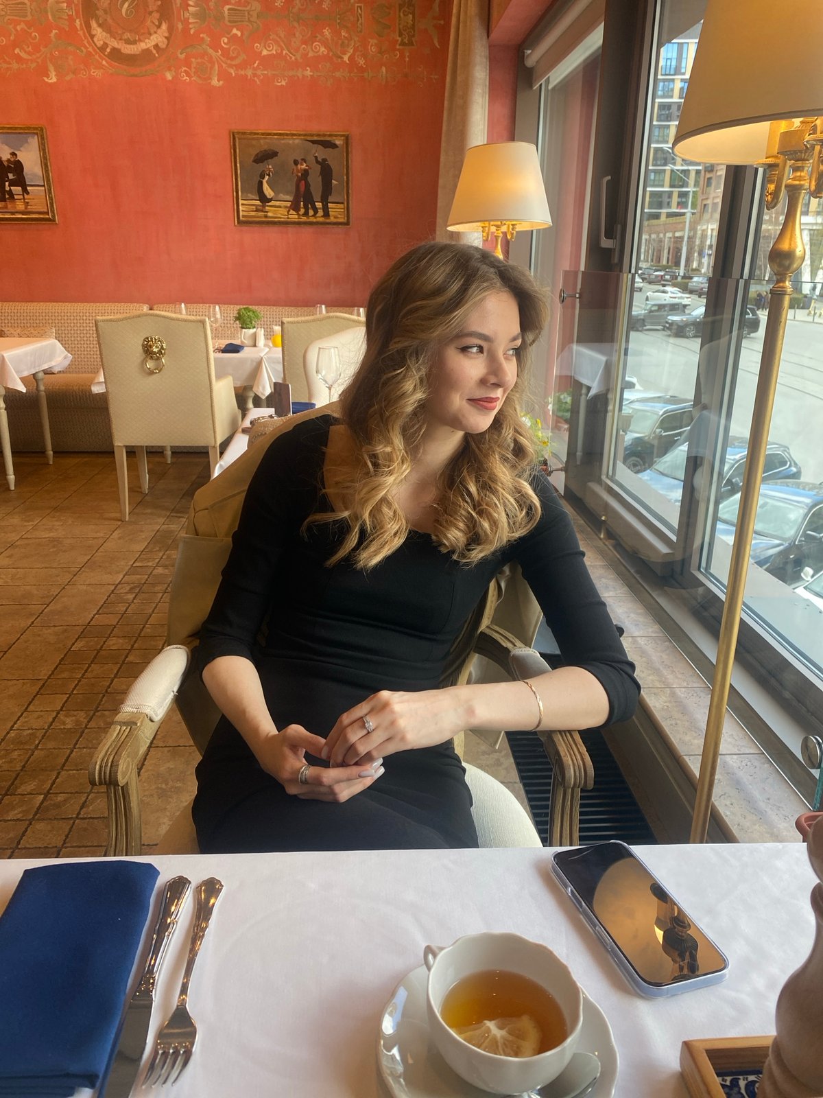 Woman dines at upscale Yekaterinburg restaurant during morning hours