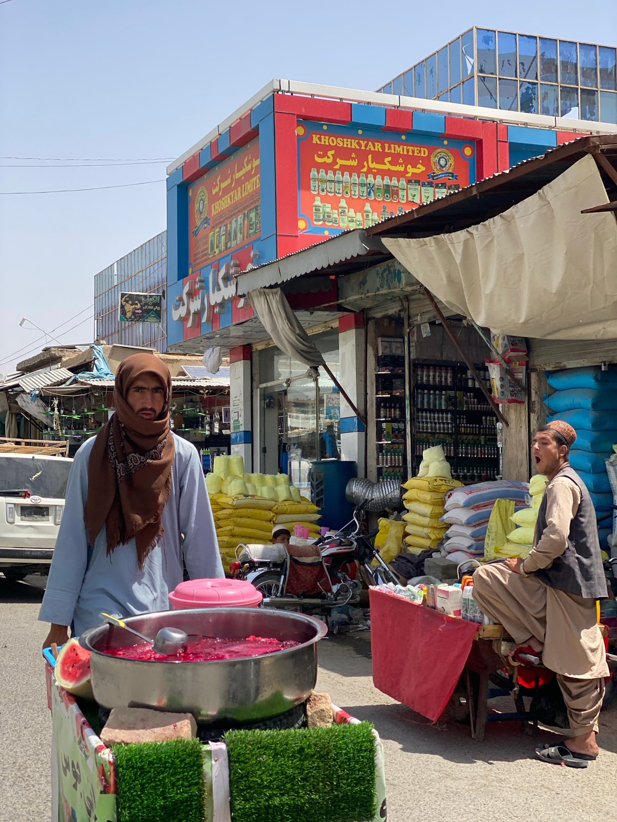 Street vendor mixes a red drink in Kandahar
