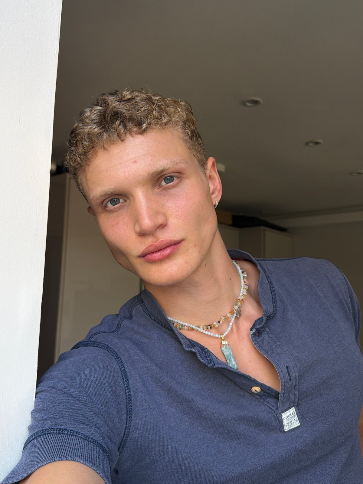 Close-up portrait in London wearing a Joules Clothing henley