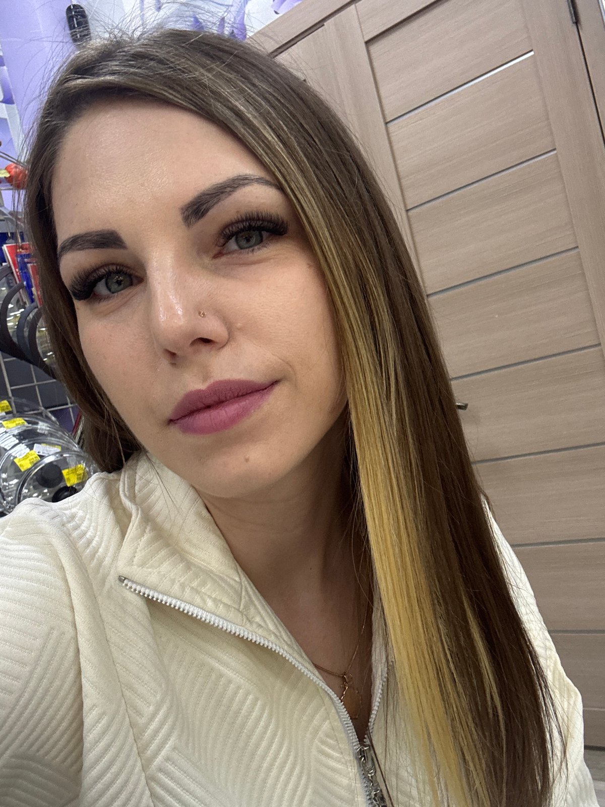 Woman takes selfies while shopping in Klin store