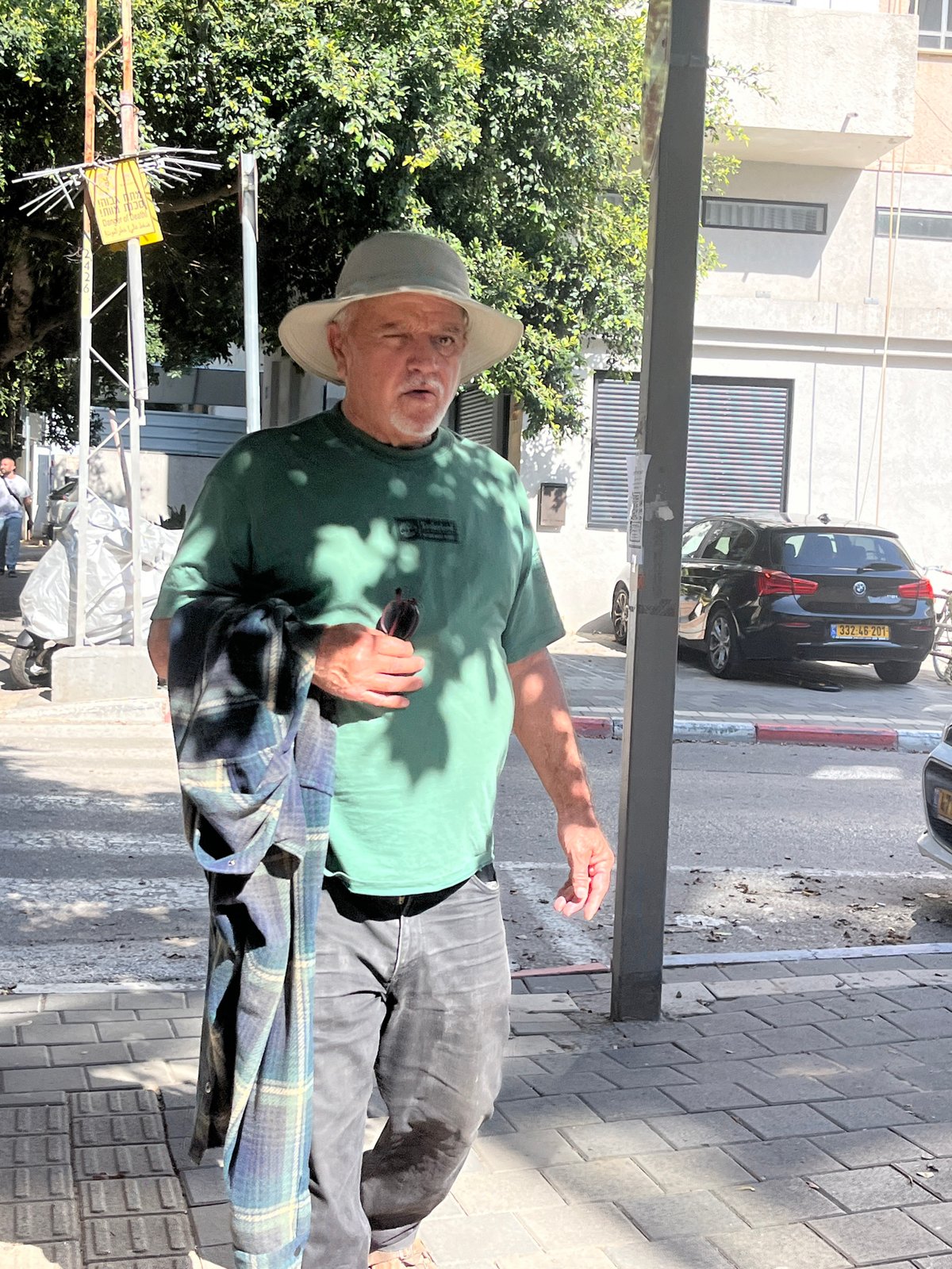Casual street life documented across Tel Aviv neighborhood Saturday afternoon