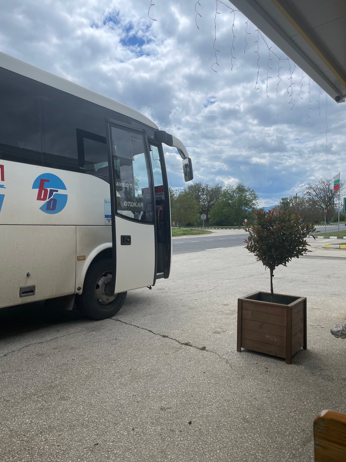 Bus parks near restaurant in Bulgarian town square