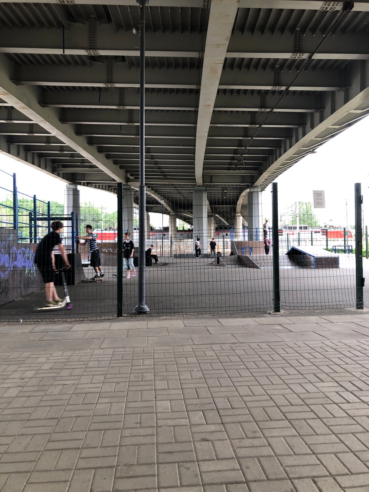 Youth gather at Saint Petersburg skate park under bridge