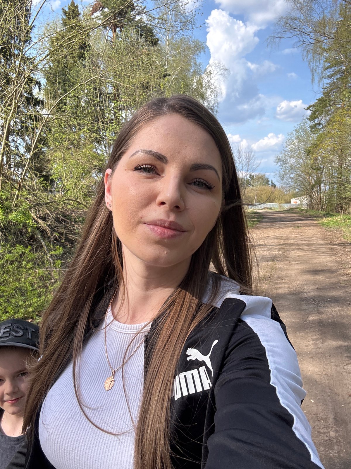 Woman conducts outdoor photo session in rural Russian village