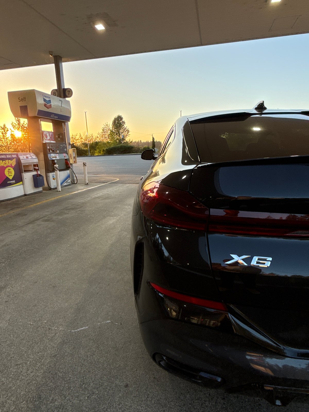 BMW refuels at Chevron station in Parksville during early morning