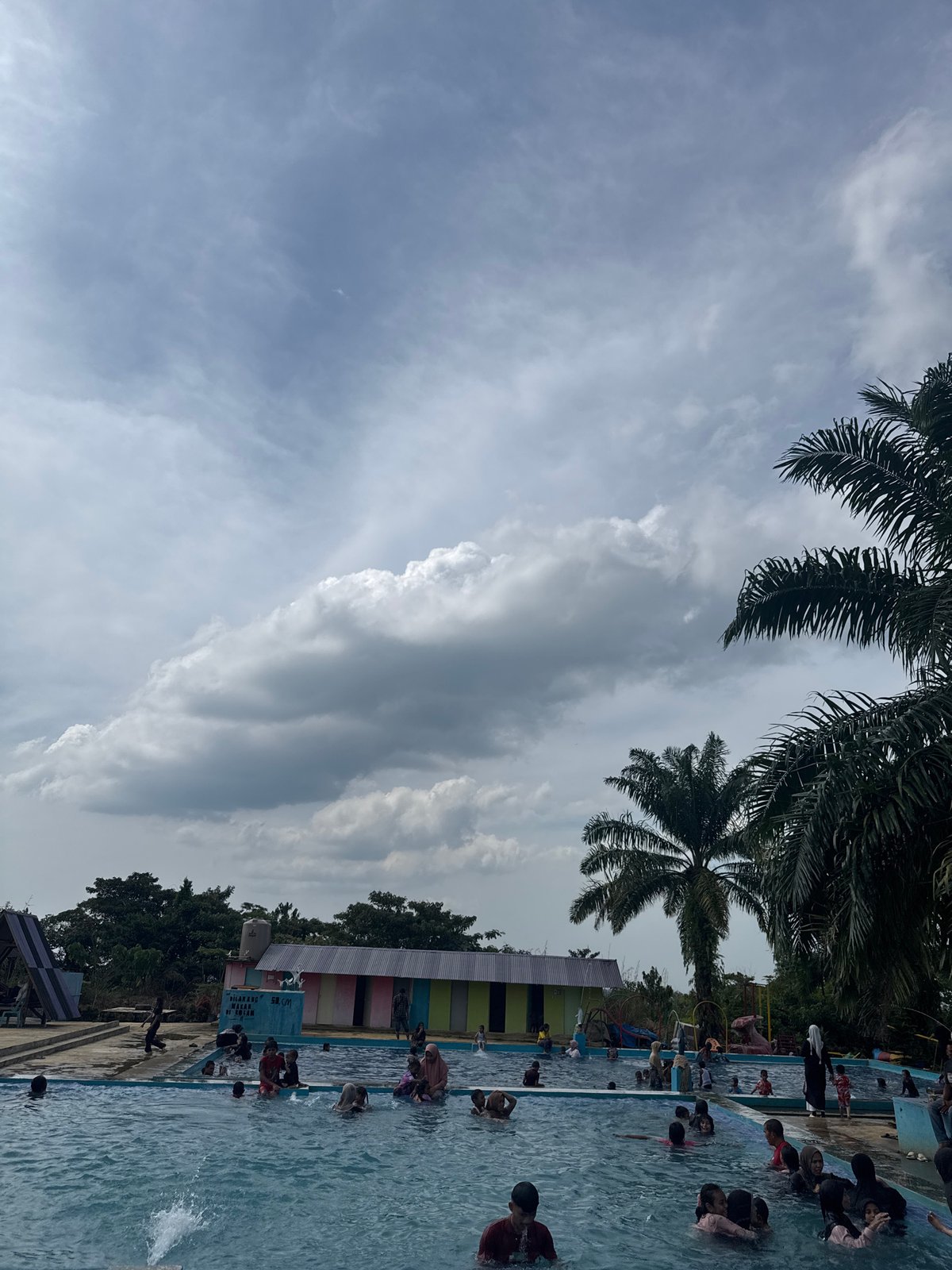 Crowded tropical pool day in Indonesia
