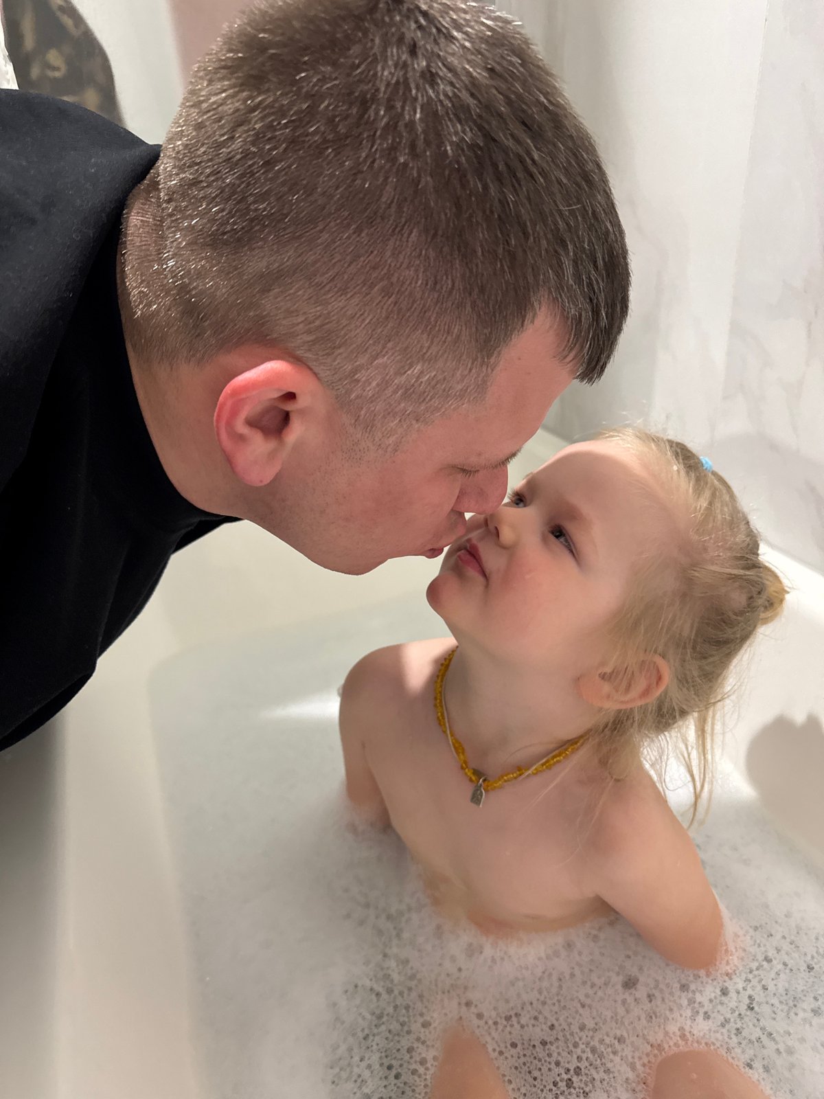 Family bath time with bubbles captured in Ферма, Russia