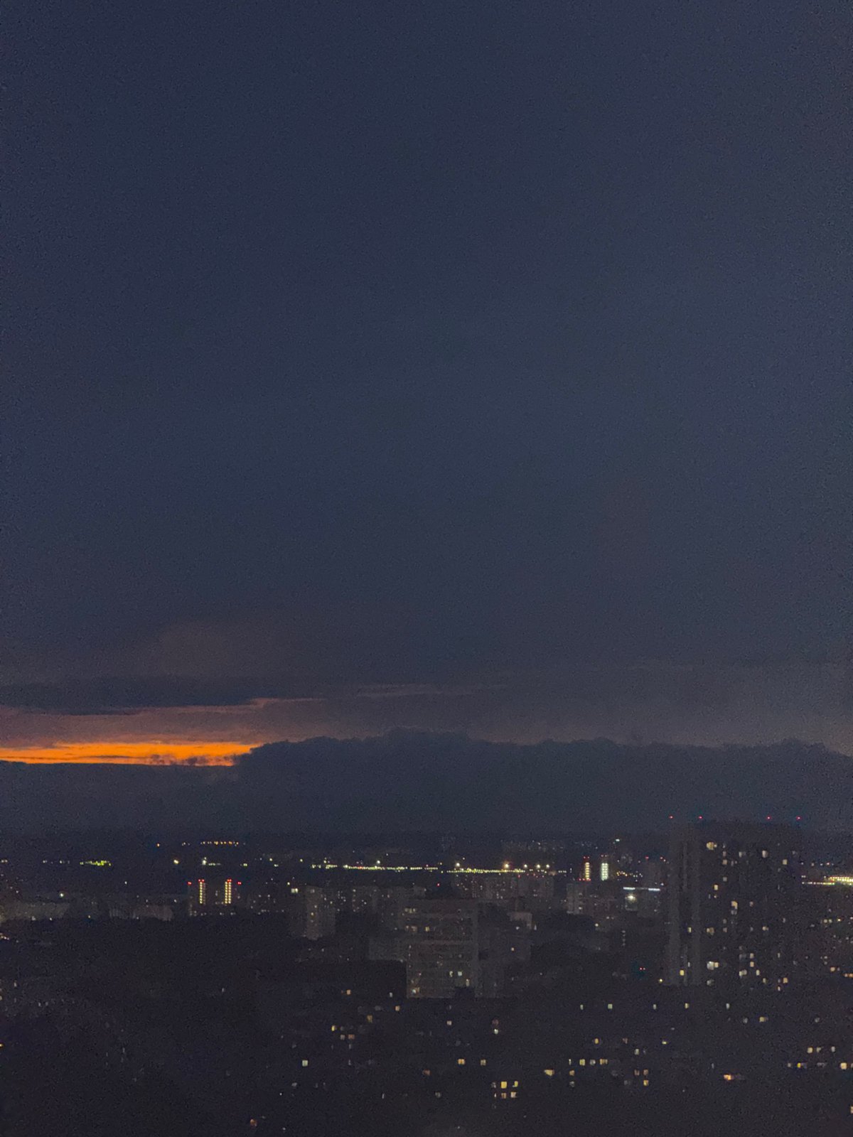 Orange glow illuminates horizon over Гамово, Russia at night